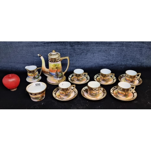 699 - STAR LOT : A complete fifteen piece Japanese Noritake porcelain coffee set. Featuring a lakeside sce... 