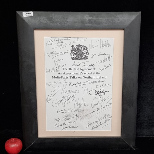 72 - A print showing the signatories of the Belfast Agreement of 1998. Held in a high quality black frame... 
