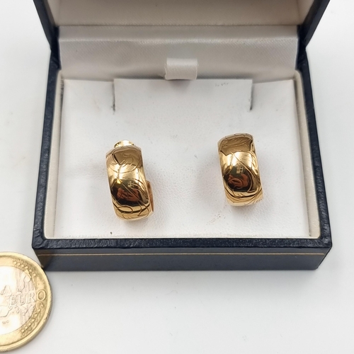 8 - A very fine pair of 9 carat gold hopped earrings, featuring nicely scrolled motif and set with stud ... 