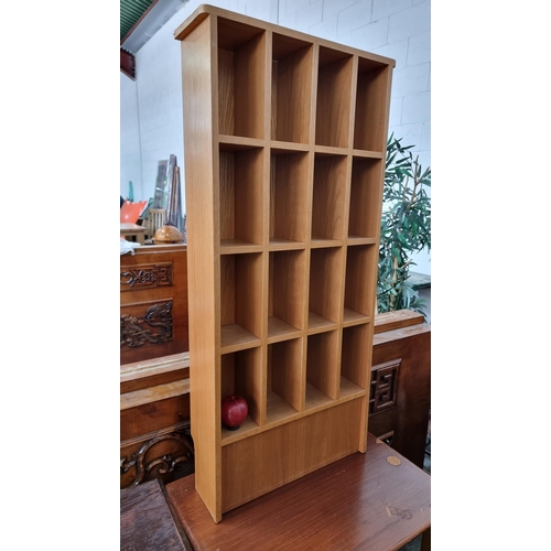 716 - A neat sized wooden shelving unit with 16 cubical for ample storage.