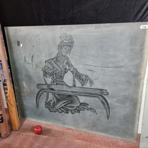 718 - A very large heavy panel of glass with frosted design of a Chinese woman playing an instrument to fr... 