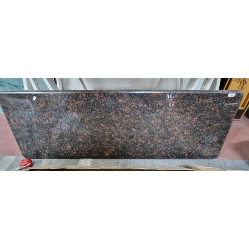 726 - A large granite / marble countertop in a black and brown colourway with rounded corners and a white ... 