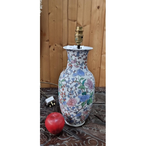 744 - A Chinese porcelain vase converted into a table lamp with handpainted flower ornament in blues and s... 