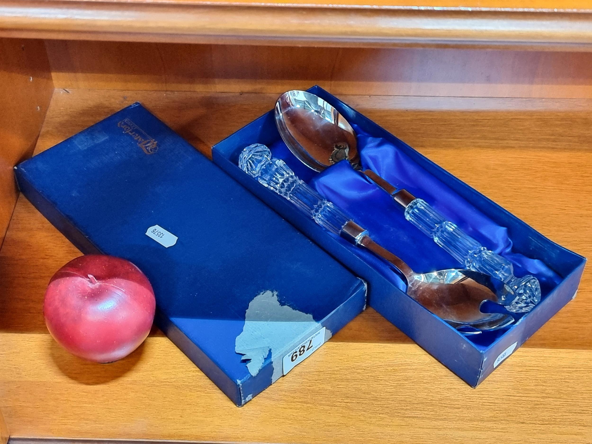 A set of Waterford Crystal salad servers featuring cut crystal handles