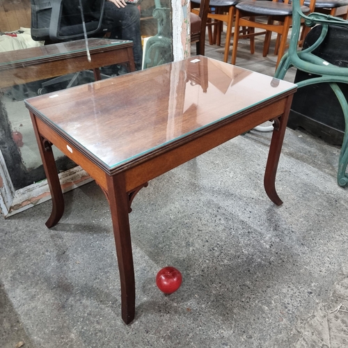 861 - A neatly proportioned Chinese wooden coffee table with tempered glass top, held on splayed legs. Lov... 