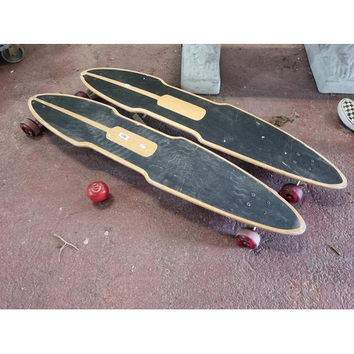 901 - Two Renner branded longboards complete with trucks and wheels.