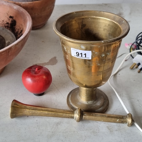 911 - A remarkably heavy, very large solid brass antique apothecary pestle and mortar with etched banding ... 