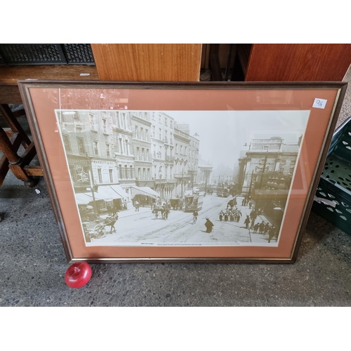 916 - Two prints both depicting a busy Grafton Street in Dublin in the 1890s. The prints are housed in a s... 