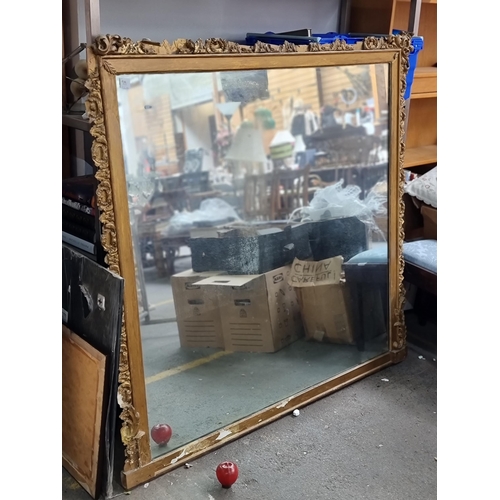 919 - Star Lot : A very large antique rectangular over mantel wall mirror with gilt wooden frame boasting ... 