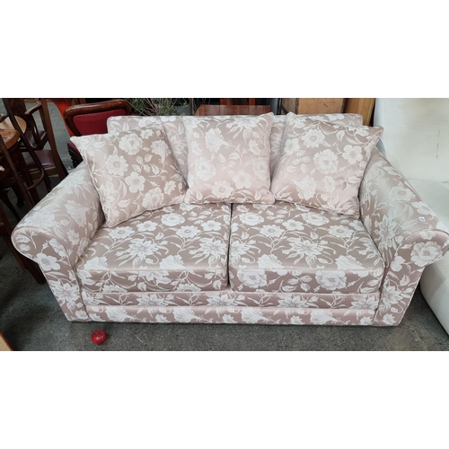 928 - Star lot : A very attractive, very high quality two seater sofa bed. Upholstered in a beautiful flor... 