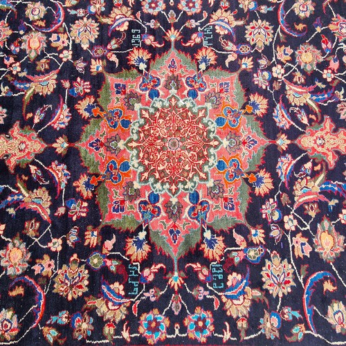 767 - Star Lot : A beautiful large handknotted vintage floor rug in rich shades of blue and fuchsia with g... 