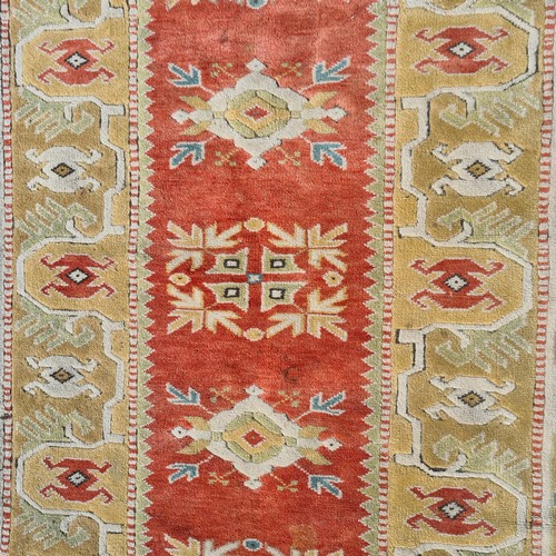 766 - Star lot : A wonderful, large Turkish handknotted rug in earthy tones of terracotta, pale green and ... 