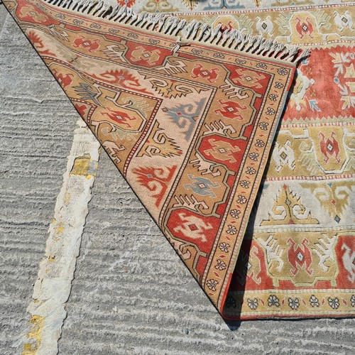 766 - Star lot : A wonderful, large Turkish handknotted rug in earthy tones of terracotta, pale green and ... 