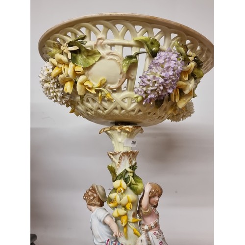 131 - Star Lot : An incredibly large and lavish vintage porcelain jardinière with a young boy and girl pla... 