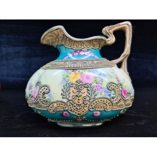 665 - A beautiful antique Noritake or Morimura porcelain jug. Featuring a floral backdrop with a delicatel... 