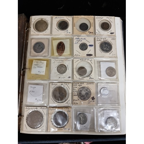 230 - A coin album of over 230 coins with their corresponding information booklets. Includes antique and v... 