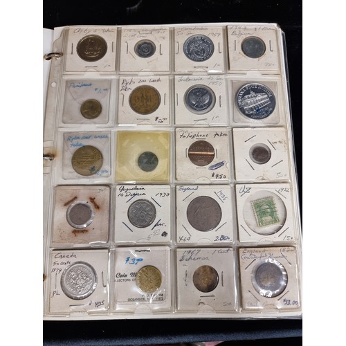 230 - A coin album of over 230 coins with their corresponding information booklets. Includes antique and v... 