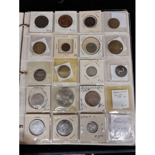 230 - A coin album of over 230 coins with their corresponding information booklets. Includes antique and v... 