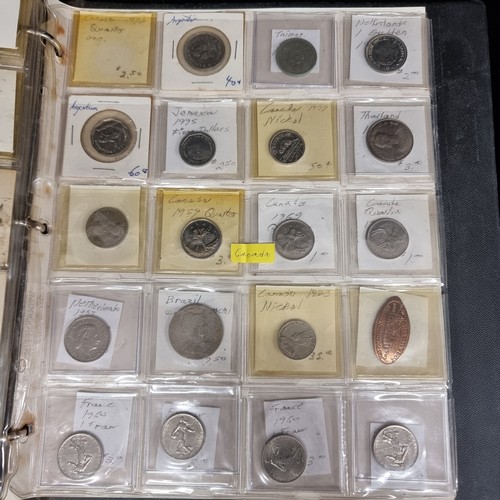 230 - A coin album of over 230 coins with their corresponding information booklets. Includes antique and v... 