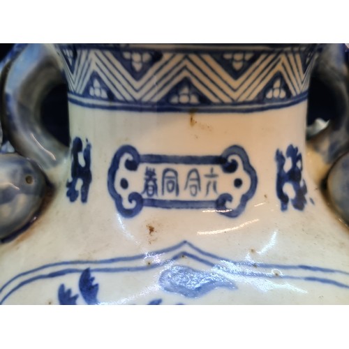 674 - A large and striking Chinese ceramic vase. Featuring large figural pomegranate handles and an unusua... 