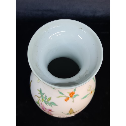 675 - A pretty vintage Chinese porcelain vase. Sporting a delicate pattern of flowers and insects. Includi... 