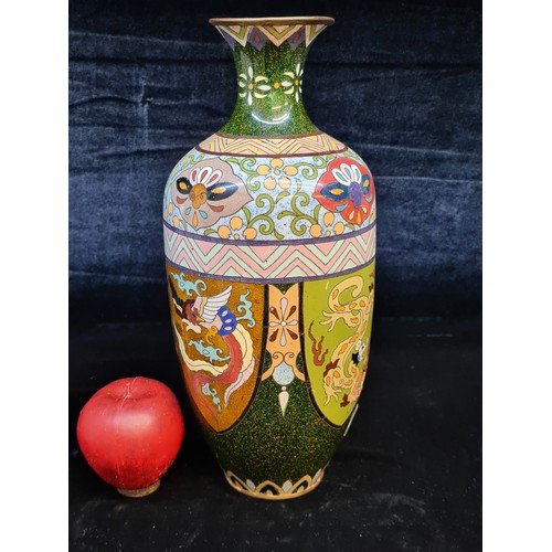 676 - Star lot : A fabulous rare Chinese cloisonné vase. Decorated with beautiful richly toned enamels, wi... 