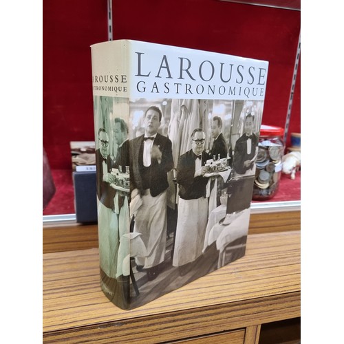 304 - A hardback cookery encyclopedia book titled 'Larousse Gastronomique'. With a hardback cover and orig... 