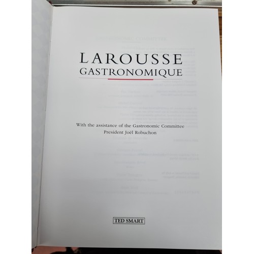 304 - A hardback cookery encyclopedia book titled 'Larousse Gastronomique'. With a hardback cover and orig... 