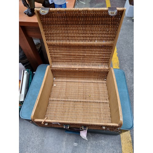 318 - A wonderful rare vintage wicker suitcase with a Bakelite handle, hinged lid, leather straps and bras... 