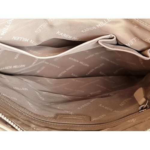 337 - A Karen Millen genuine leather bag with plenty of storage to front as well as interior in a light be... 