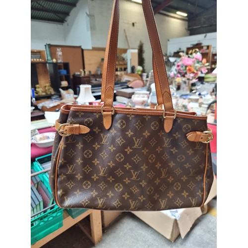 338 - Star Lot : A beautiful genuine Louis Vuitton ladies handbag featuring the iconic monogram in brown a... 