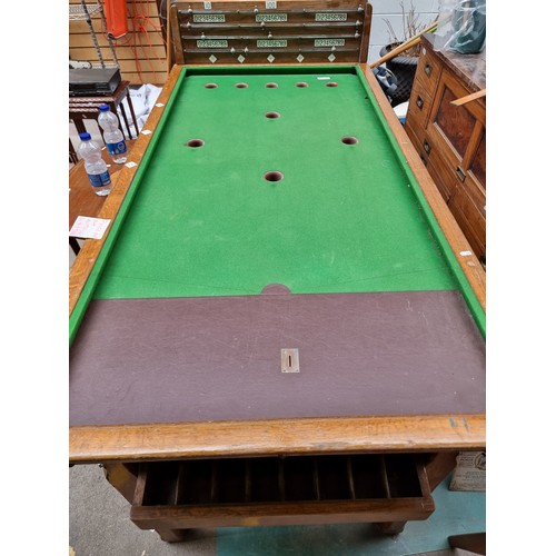 350 - Star lot : A fabulous vintage coin operated billiards table with a green baize top with 9 holes and ... 