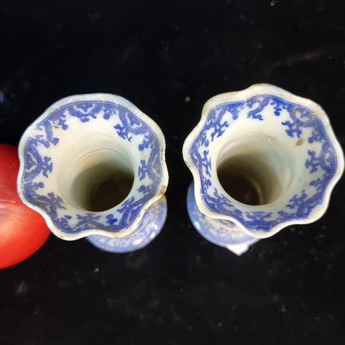 695 - A pair of antique Chinese blue vase glazes in a cylindrical form with fluted rims. One signed to bas... 