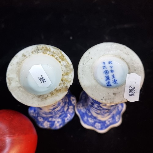 695 - A pair of antique Chinese blue vase glazes in a cylindrical form with fluted rims. One signed to bas... 