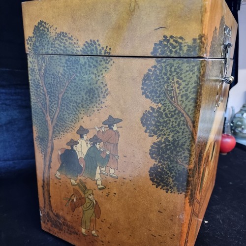 701 - A large Chinese inspired storage chest. Featuring a rich golden stain and a peaceful scene of schola... 