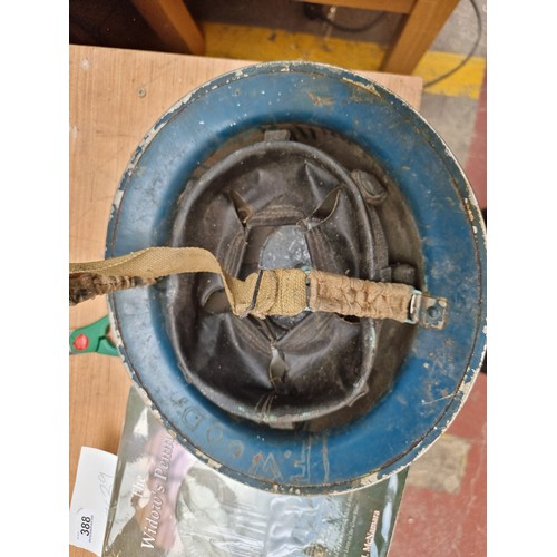 389 - A genuine vintage Brodie helmet. A British military helmet circa WWII. Featuring a hand applied ''R'... 