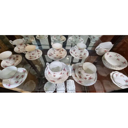 783 - A fifty eight piece Richmond Bone China tea set in the Rose Time pattern. Designed with an elegant s... 