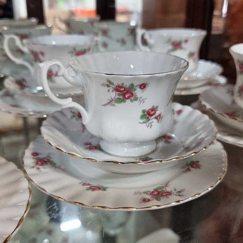 783 - A fifty eight piece Richmond Bone China tea set in the Rose Time pattern. Designed with an elegant s... 