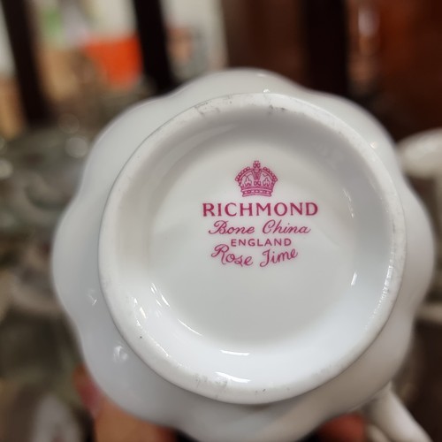 783 - A fifty eight piece Richmond Bone China tea set in the Rose Time pattern. Designed with an elegant s... 