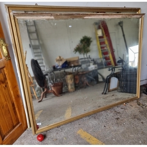 745 - Star Lot : A magnificent very large mantle mirror housed in a wonderful gold gilt frame. The bottom ... 