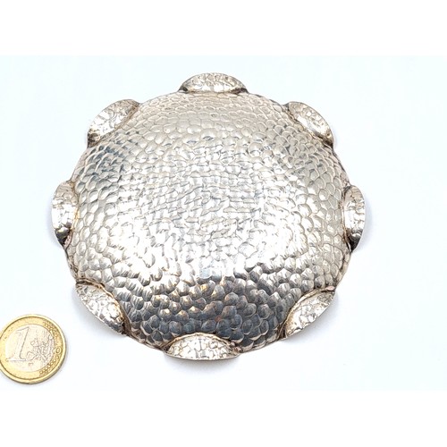 12 - An unusual large and heavy hammered Irish silver pin dish, featuring an exaggerated scalloped edge. ... 