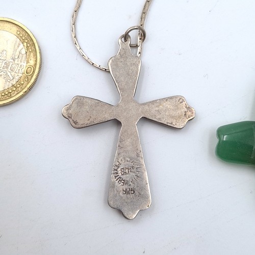 16 - Two pendants, the first is a Abalone cross example which features a Sterling silver chain. Length: 4... 