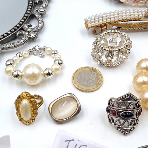 17 - A large and assorted collection of jewellery, consisting of bracelets, pearl examples, necklaces, ge... 