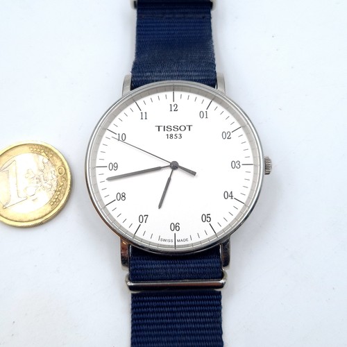 22 - A Tissot large face sports style Swiss made wrist watch, featuring its original Tissot navy strap, w... 