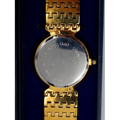 40 - A fabulous  Warwick Watch Company gold toned wrist watch, set with an enamelled white face, Roman nu... 