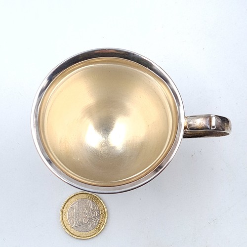 54 - A nice example of an Irish silver presentation cup, featuring a flying C handle, nicely formed body ... 