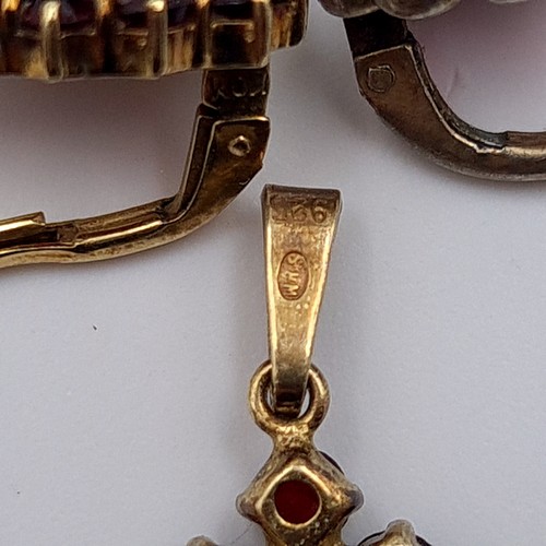 502 - An attractive 925 silver gilt Garnet suite, consisting of a pendant and a matching pair of Garnet cl... 