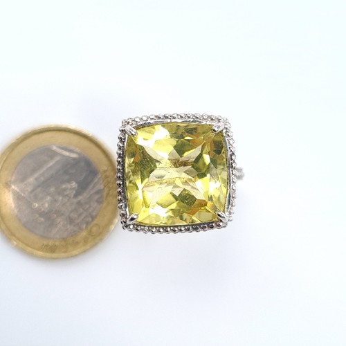 515 - A show stopping sterling silver citrine ring, this example features a raised lattice mount and fabul... 