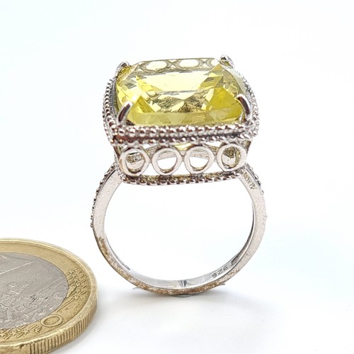 515 - A show stopping sterling silver citrine ring, this example features a raised lattice mount and fabul... 