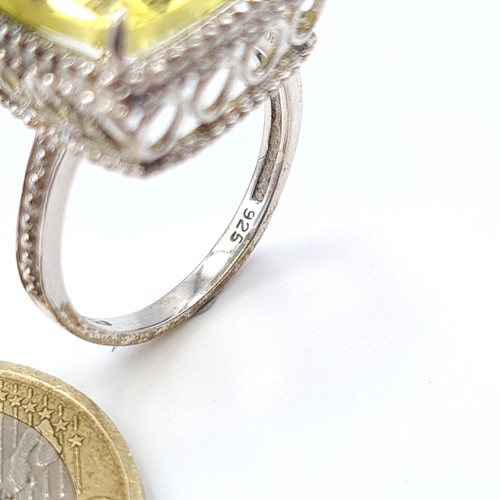 515 - A show stopping sterling silver citrine ring, this example features a raised lattice mount and fabul... 